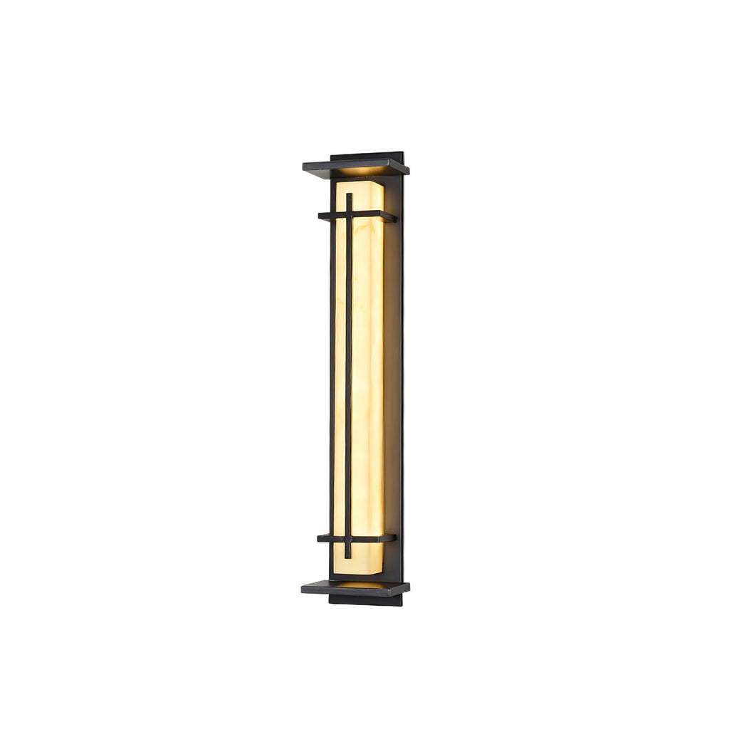 Lit Clérachic wall light on white, with the warm shade visible and a thin glow at the top of the dark frame.