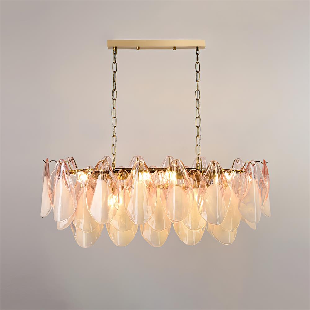 Clérachic linear chandelier in blush pink glass petals hangs from two chains for a long table.
