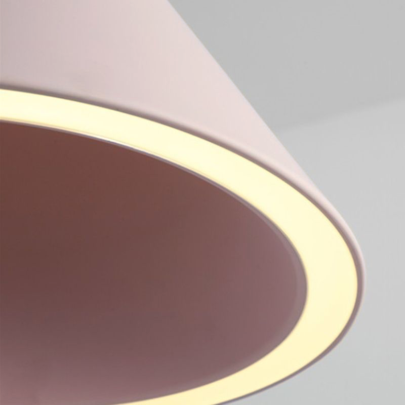 Close view of the Clérachic Funnel Pendant Light rim, where the acrylic ring lights the deeper pink of the cone's inner face.