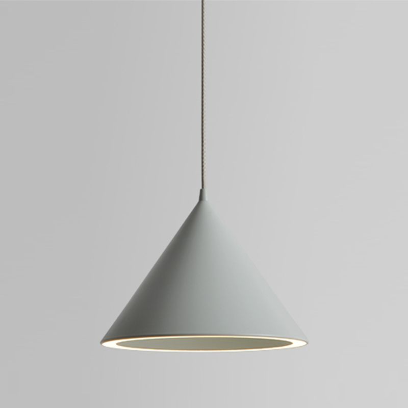 The Clérachic Funnel Pendant Light in gray, its straight-sided cone and warm lit rim shown against a neutral studio wall.