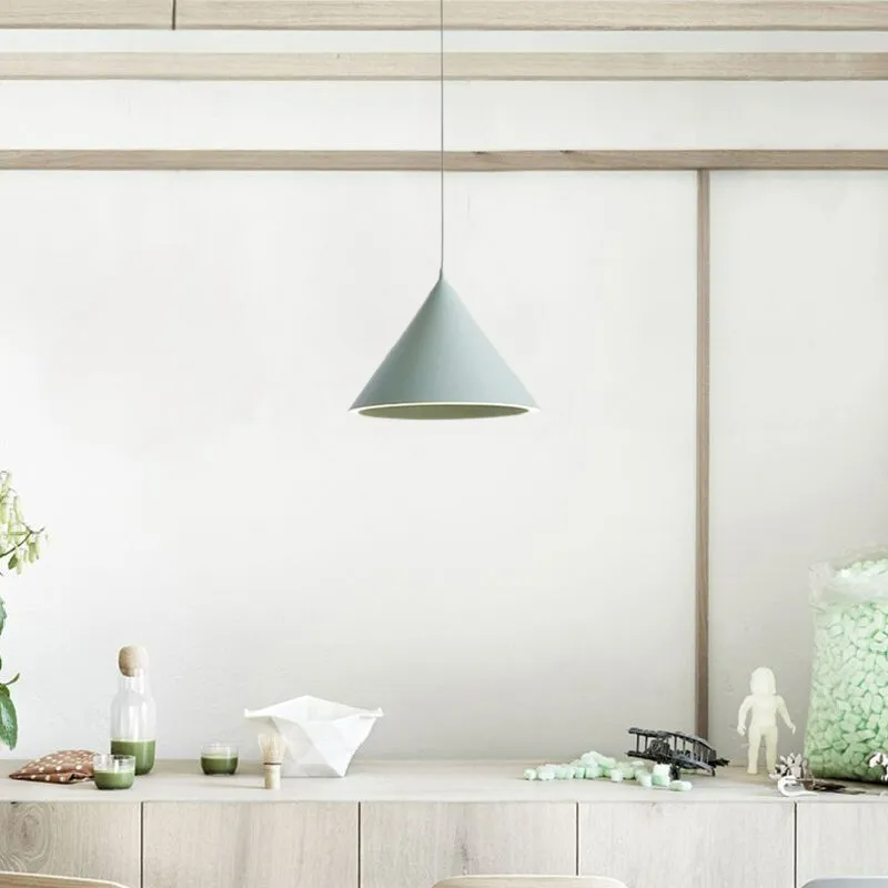 The Clérachic Funnel Pendant Light in gray above the same oak sideboard, hung on a matching cord in a calm, low-lit corner.