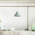 The Clérachic Funnel Pendant Light in gray above the same oak sideboard, hung on a matching cord in a calm, low-lit corner.