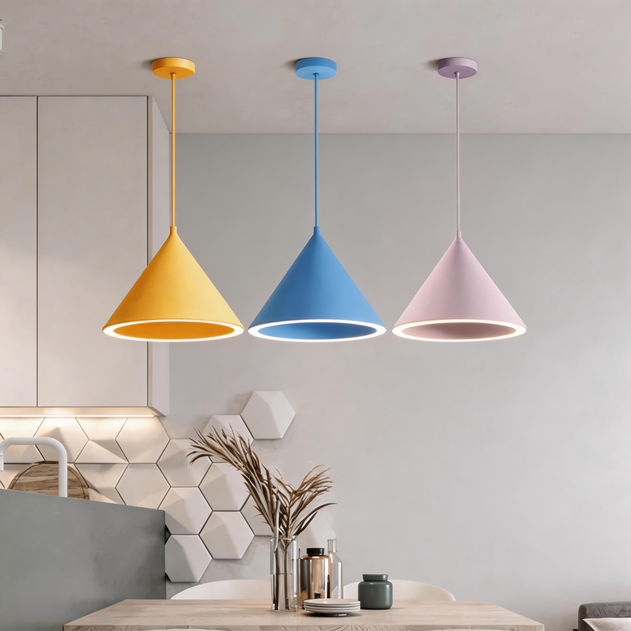 Yellow, blue and pink Clérachic Funnel Pendant Lights on matching ceiling canopies over a kitchen island, rims lit warm white.