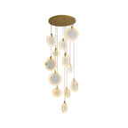 A narrower crop of the unlit Clérachic alabaster disc cluster, with the gold canopy and cords above on white.