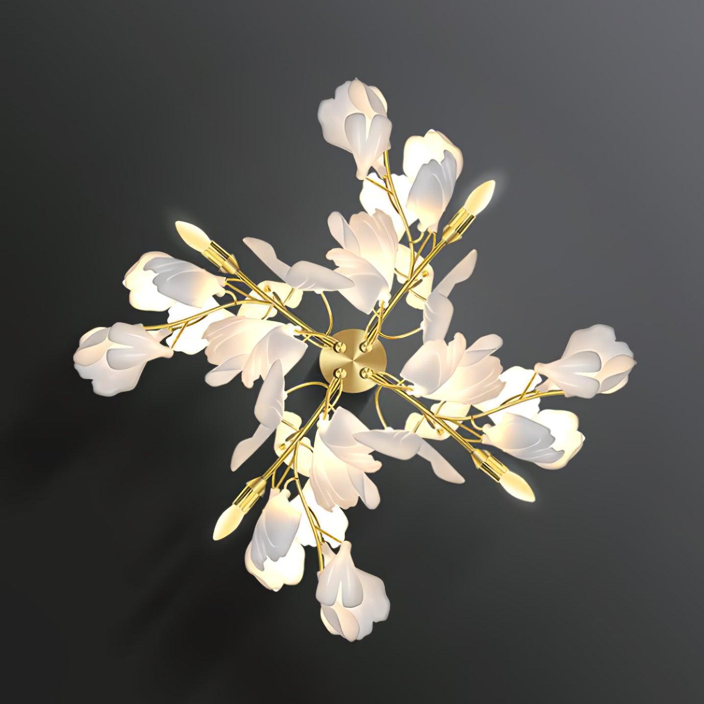 The Clérachic gingko sconce face-on, gold stems radiating outward with white petal shades at every tip.