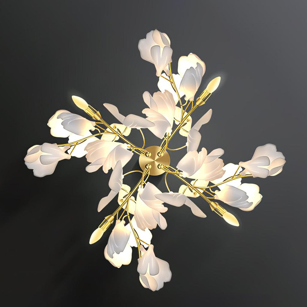 Angled view of the Clérachic gingko sconce, layered petal shades along gilded leaf-shaped arms.
