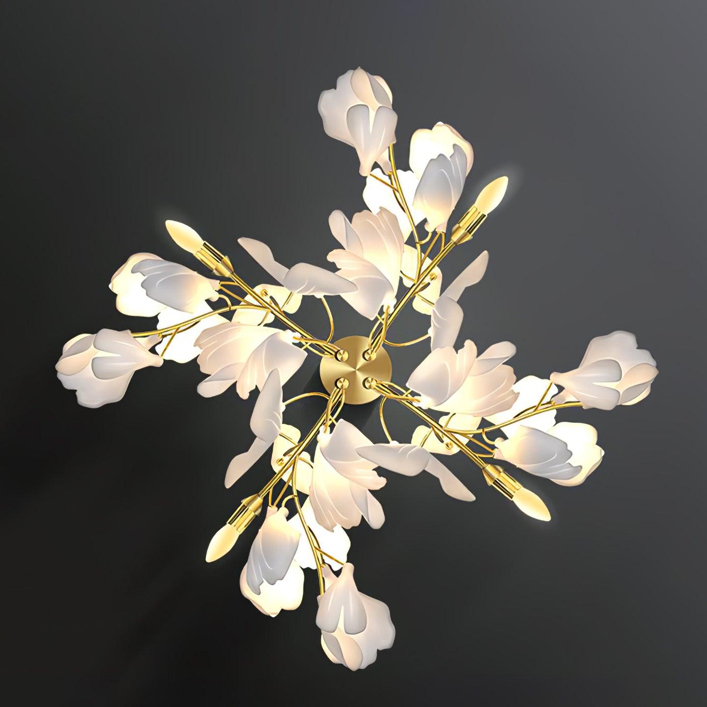 Angled view of the Clérachic gingko sconce, layered petal shades along gilded leaf-shaped arms.