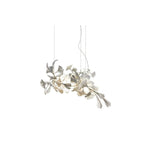 Clérachic gingko chandelier on white, a compact spray of pale ceramic leaves on slender stems.