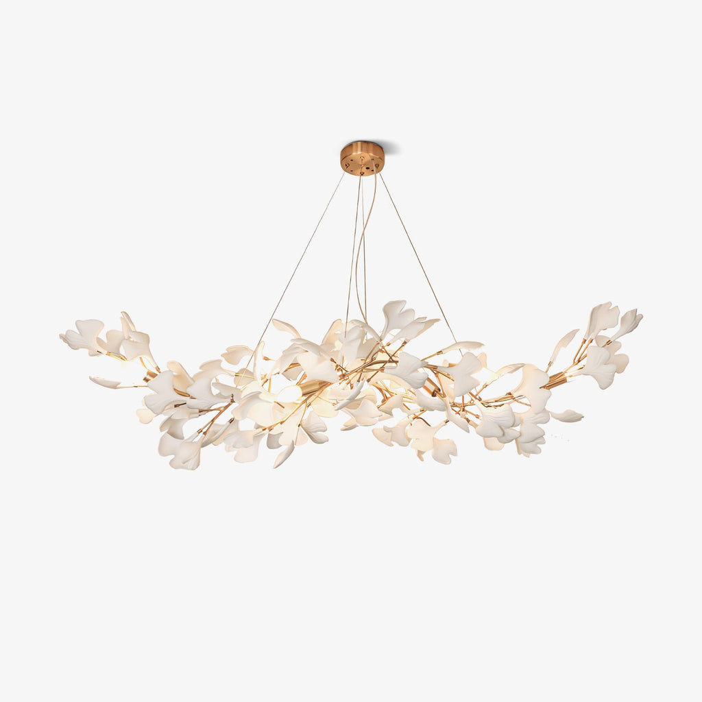 Clérachic gingko chandelier on white, gold arms fanning out under a round canopy with white leaves.