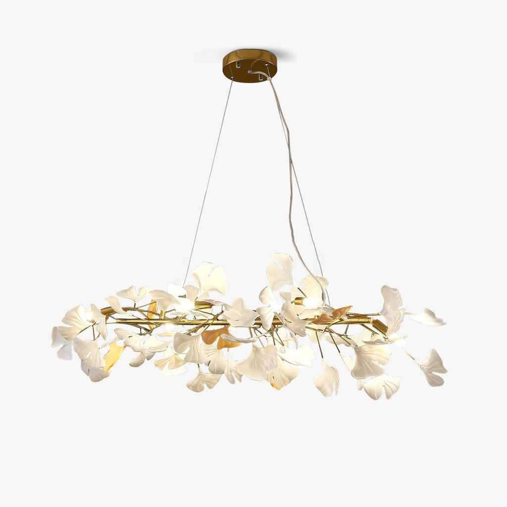 Clérachic gingko ring chandelier on white, gold branches ringed with white ceramic leaves.
