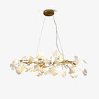 Clérachic gingko ring chandelier on white, gold branches ringed with white ceramic leaves.