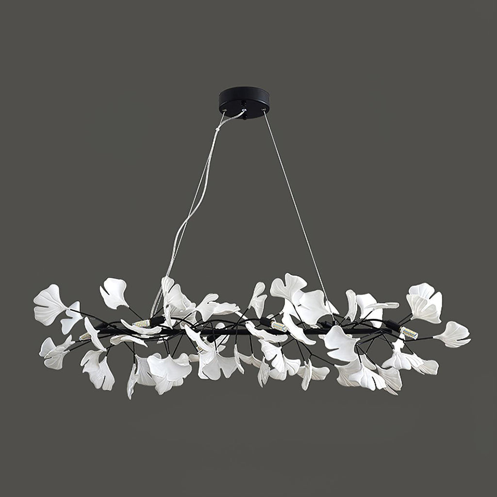 Clérachic gingko ring chandelier in black, its white leaves ringed against a grey background.