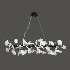 Clérachic gingko ring chandelier in black, its white leaves ringed against a grey background.
