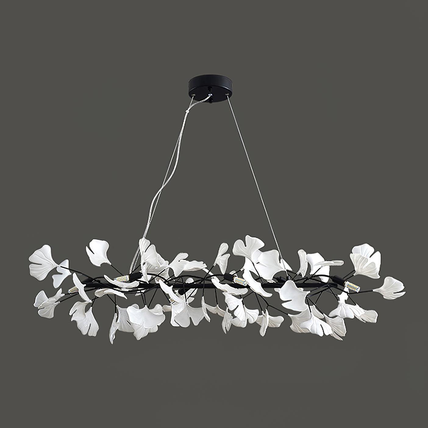 Clérachic gingko ring chandelier in black, its white leaves ringed against a grey background.