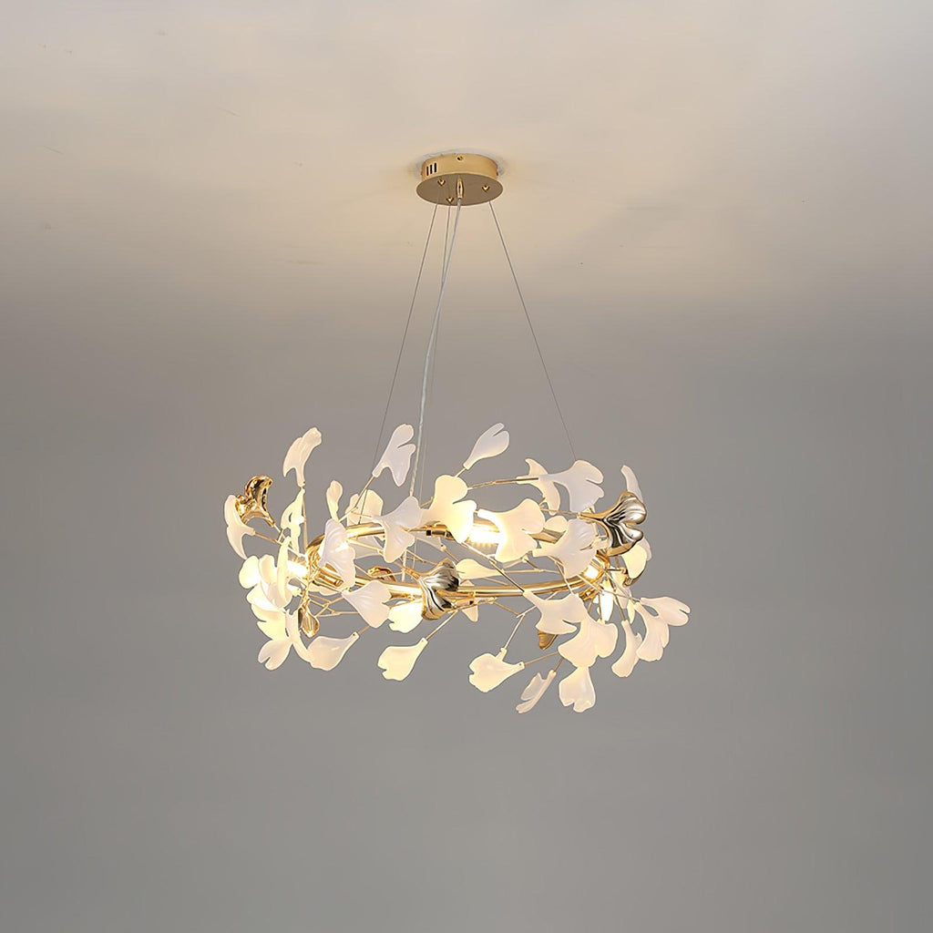 Clérachic gingko chandelier, porcelain and gilt leaves ringing a gold frame on grey.