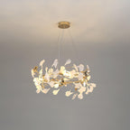 Clérachic gingko chandelier, porcelain and gilt leaves ringing a gold frame on grey.