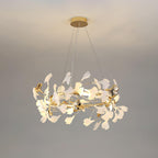 The Clérachic gingko ring seen closer on grey, leaves layered thickly around the frame.