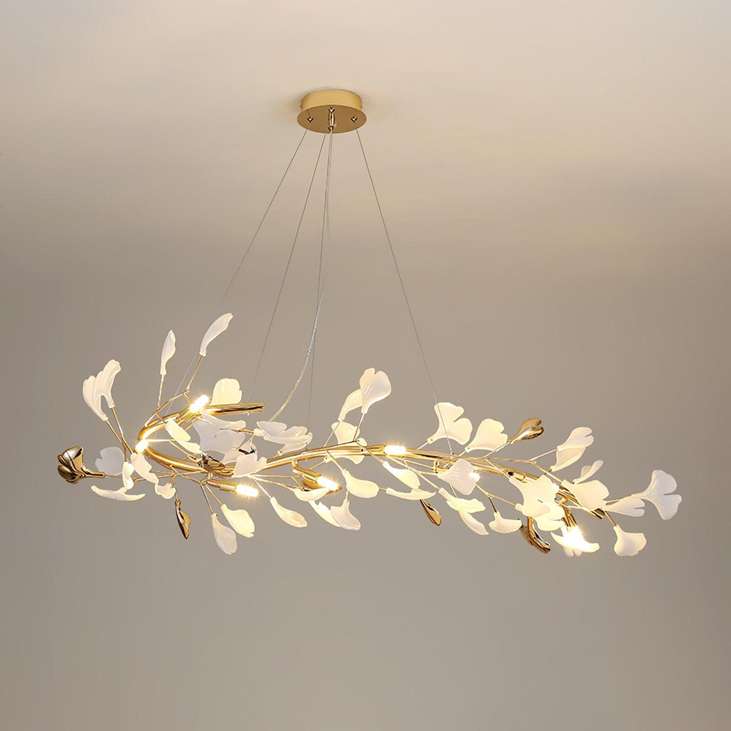 Clérachic gingko chandelier in its long linear form, leaves running the length of a gold branch.