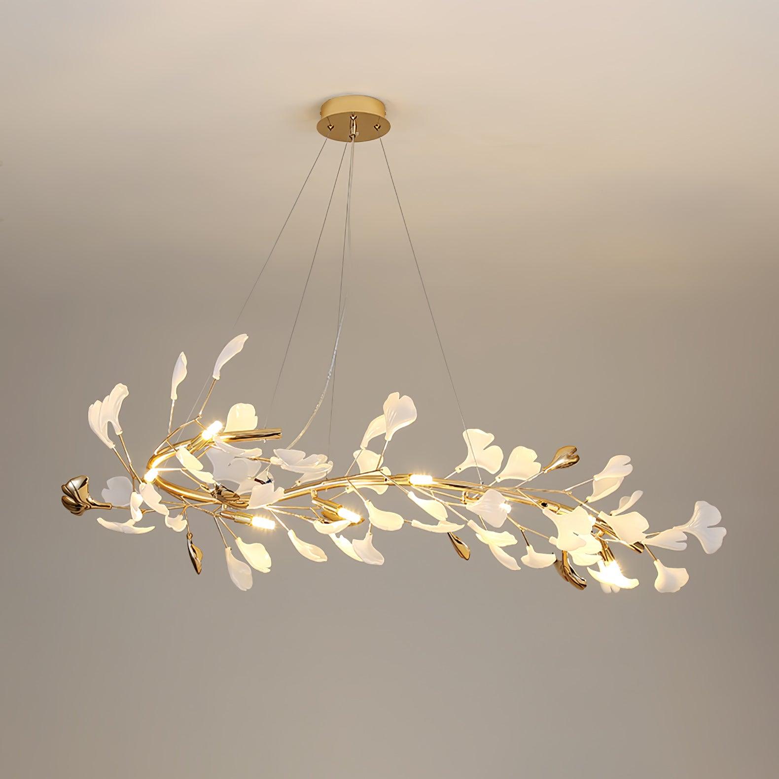 Clérachic gingko chandelier in its long linear form, leaves running the length of a gold branch.