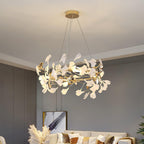 The Clérachic gingko ring lit above a cream sofa in a grey room with pampas grass.