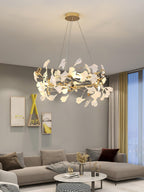 The Clérachic gingko ring lit in a grey living room above a houndstooth-cushioned sofa.