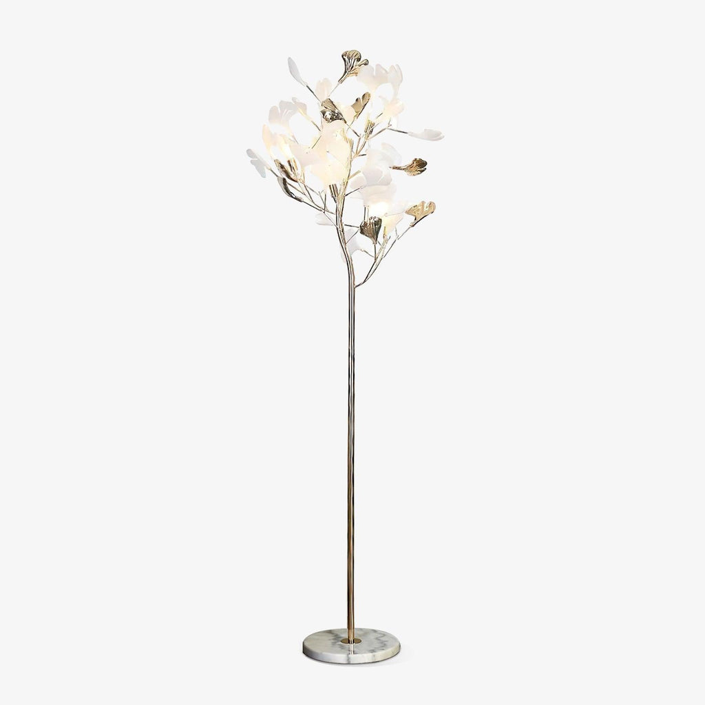 The Clérachic gingko floor lamp with a pale marble base, white leaves gathered like a small tree.