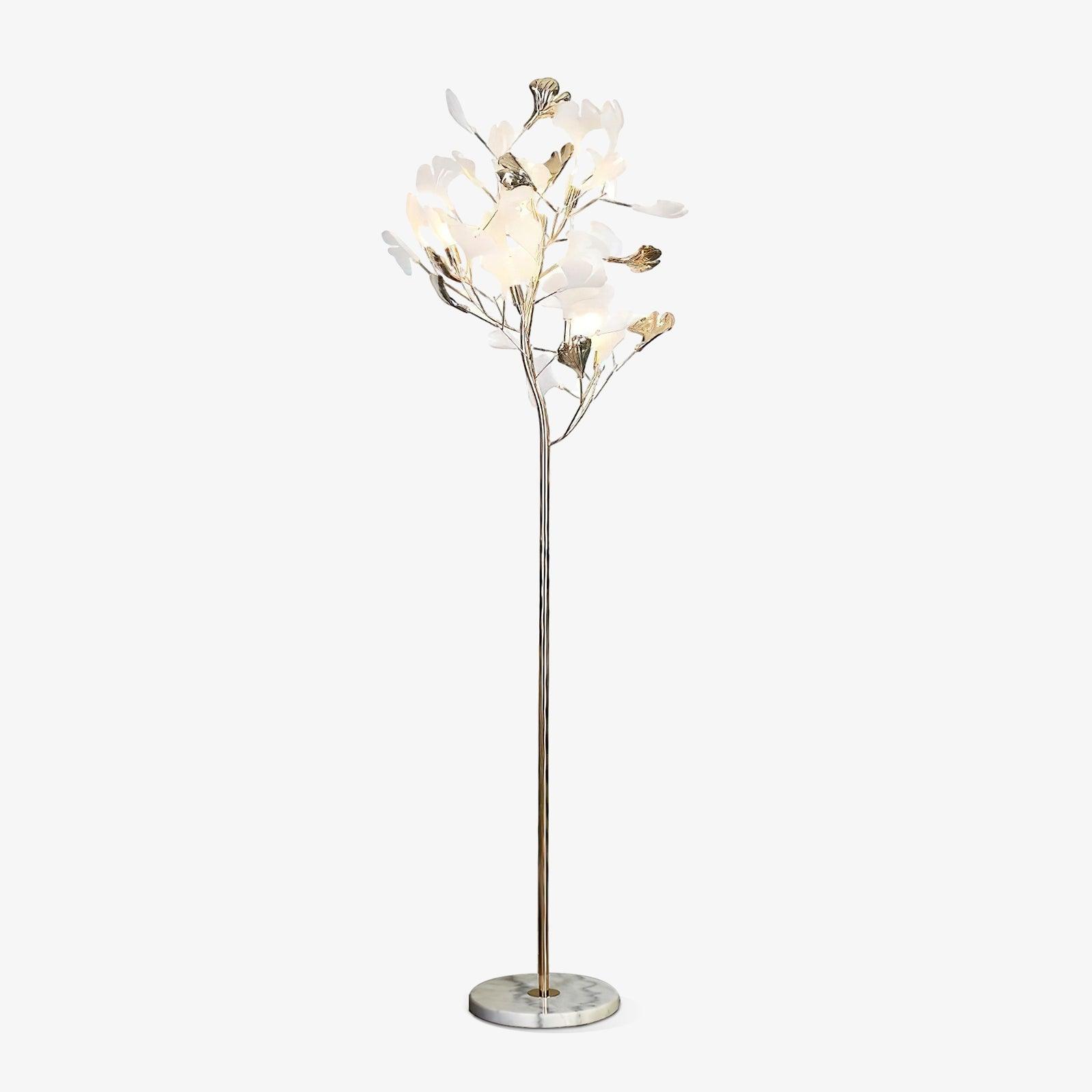 The Clérachic gingko floor lamp with a pale marble base, white leaves gathered like a small tree.