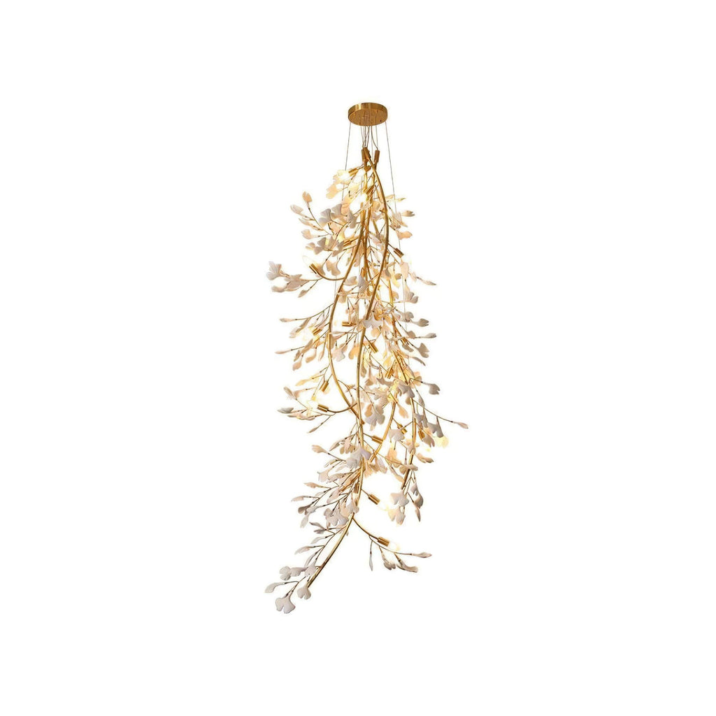 Clérachic gingko branch chandelier on white, a long cascade of ceramic leaves down a gold stem.