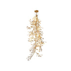 Clérachic gingko branch chandelier on white, a long cascade of ceramic leaves down a gold stem.