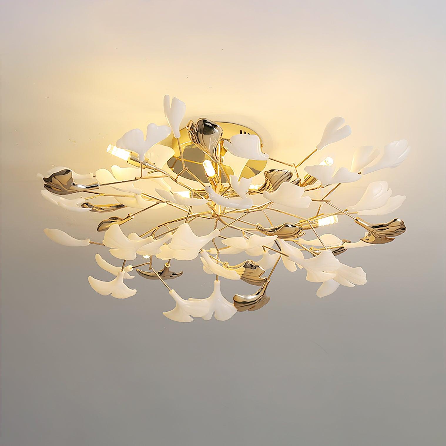 The Clérachic gingko ceiling light glowing warm, layered leaves casting soft light across the ceiling.