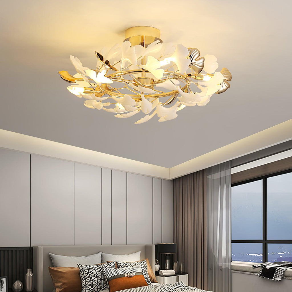 The Clérachic gingko ceiling light lit above a bed in a panelled bedroom with a window seat.