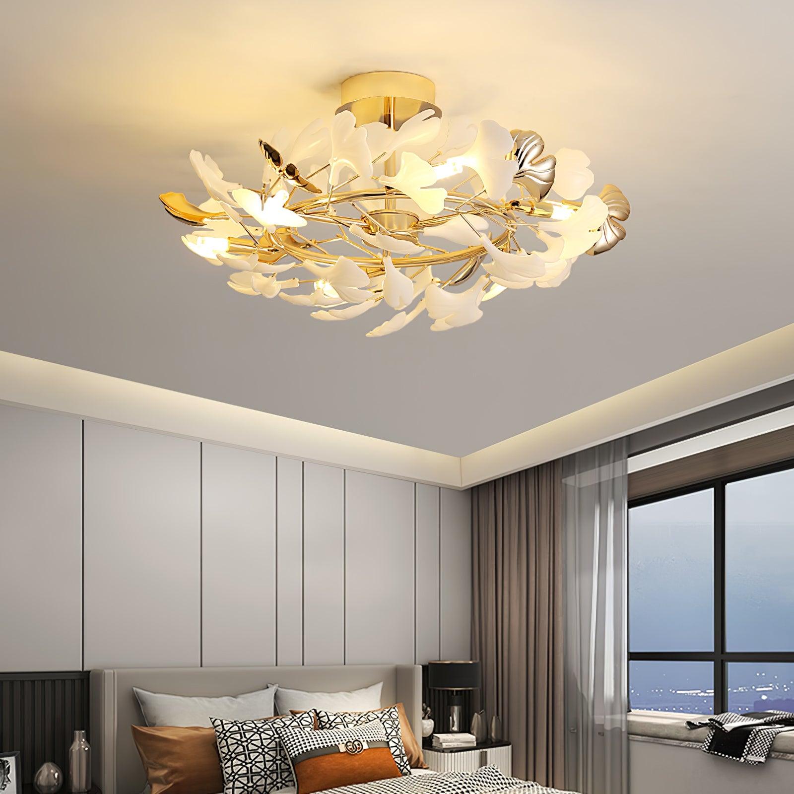The Clérachic gingko ceiling light lit above a bed in a panelled bedroom with a window seat.