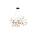 Clérachic gingko chandelier, porcelain leaves ringing a gold branch frame on white.