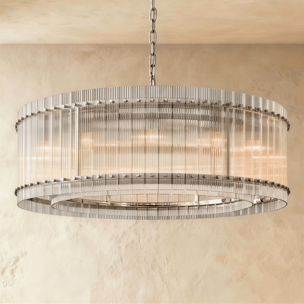 Clérachic larger drum chandelier of fluted glass rods with polished nickel studs and an inner ring, lit warm on a chain.