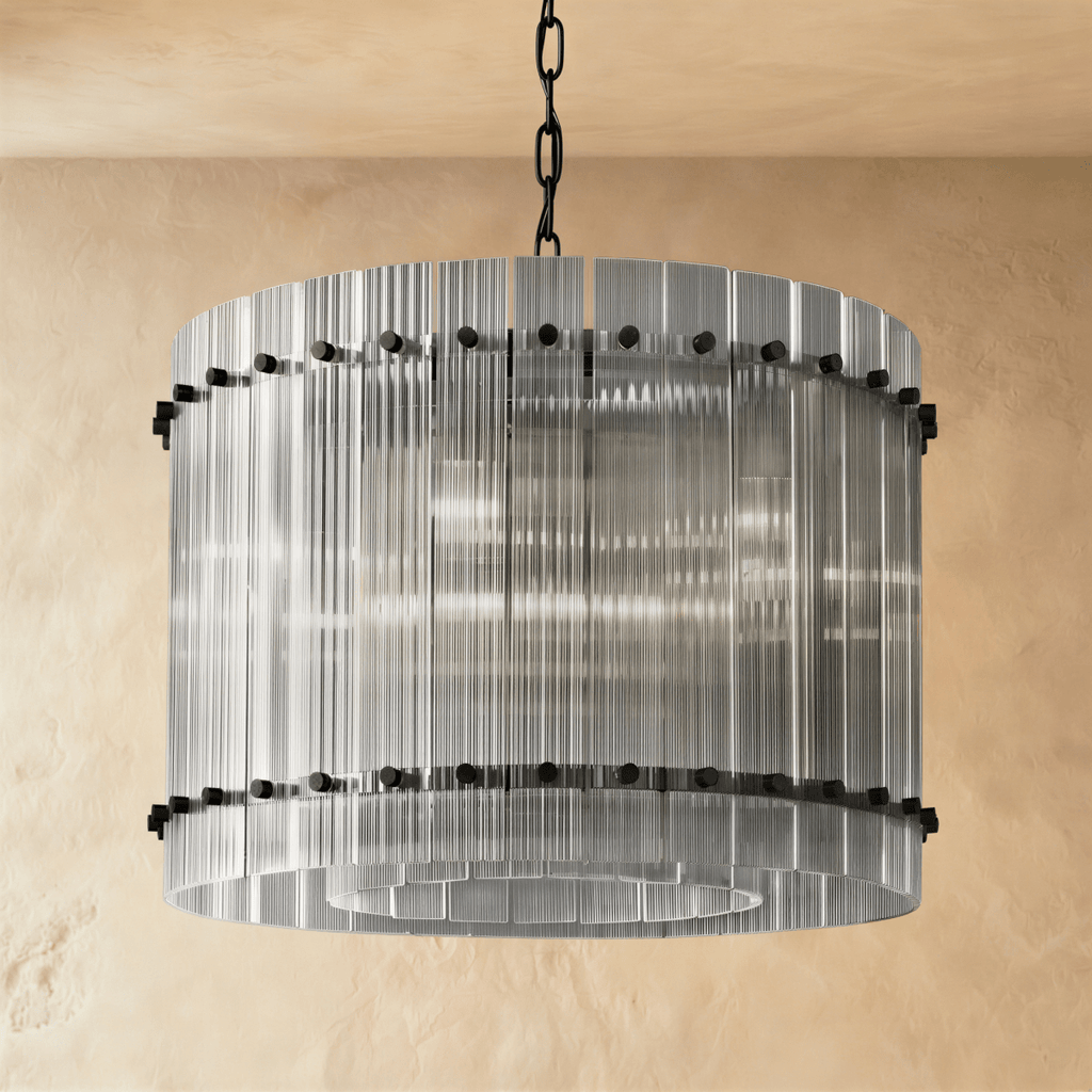 Clérachic compact drum chandelier of clear fluted glass rods with matte black studs, switched off and see-through on a chain.