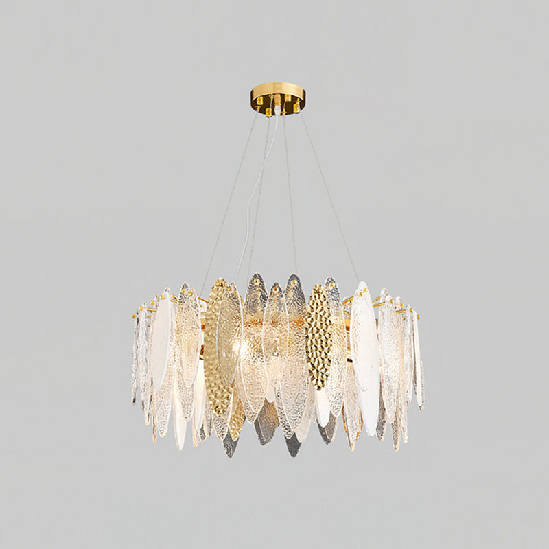 Larger Clérachic chandelier with clear glass leaves and a few gold hammered-look panels, on a grey backdrop.