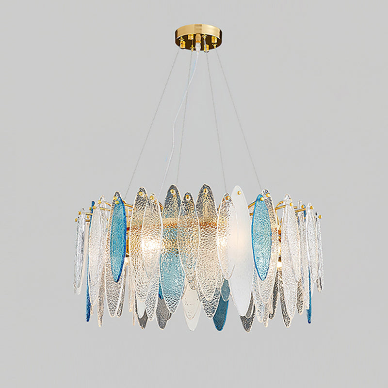 Wide Clérachic chandelier with clear and blue glass leaves, hanging on fine wires from a gold canopy.