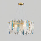 Wide Clérachic chandelier with clear and blue glass leaves, hanging on fine wires from a gold canopy.