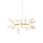 A round Clérachic chandelier on a plain white backdrop, its frosted white glass leaves spread around a gold ring on fine wires.