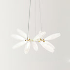 A wide-angled view of the round Clérachic chandelier, its frosted white glass leaves fanning out from a slim gold ring on fine wires.
