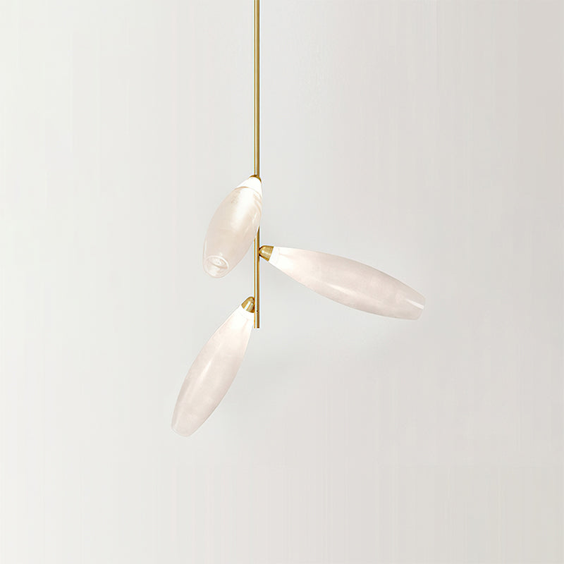Three frosted glass leaves branching from one gold stem, a single arm of this Clérachic chandelier on a pale backdrop.