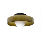 Olive-brown glass-disc ceiling light from Clérachic, black plate and white globe, with the inside of the disc showing a gold tone.