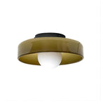 A second view of the olive-brown Clérachic glass-disc ceiling light, with its black plate and white globe, on white.
