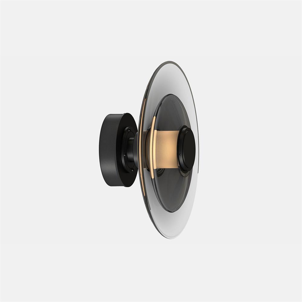 A Clérachic wall light with a smoked-glass disc and a black back plate, seen from the side on a pale grey backdrop.