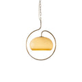 Yellow-cream glass Clérachic pendant with a gold-toned ring on a chain, shown on a plain white background.