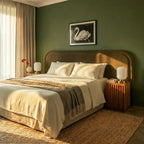 Clérachic ribbed glass dome table lamps in white on twin fluted-wood nightstands beside a green-walled bed by day.