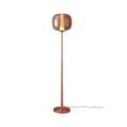 Slim rose gold Clérachic floor lamp on a white ground, its glass head lit with a thin vertical strip of light.
