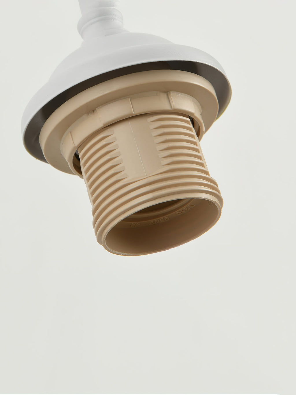 Close view of the bulb socket and collar at the end of the arm on this Clérachic wall light.