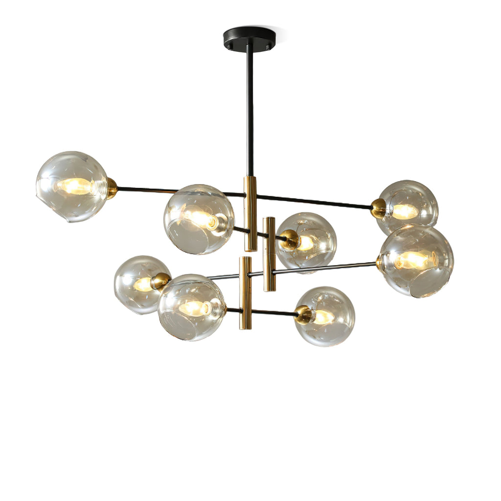 Eight-head Clérachic chandelier with amber glass globes and black and brass arms, lit and angled slightly on a white background.