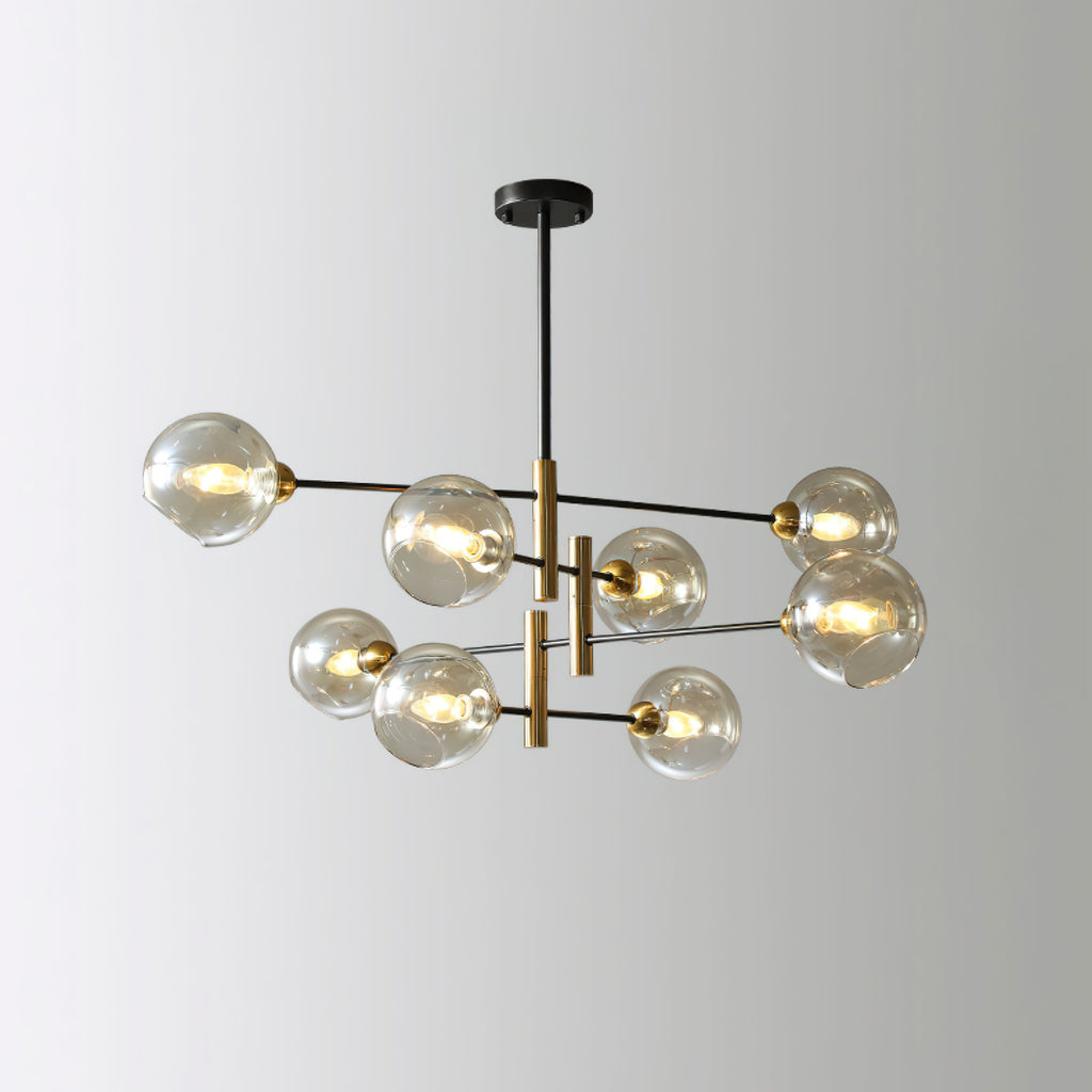 Eight-head Clérachic chandelier with amber globes, seen from a slight angle against a pale grey backdrop.